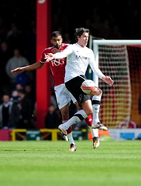 Bristol City vs Barnsley: Liam Fontaine's Battle for the Ball at Ashton Gate Stadium, 2012