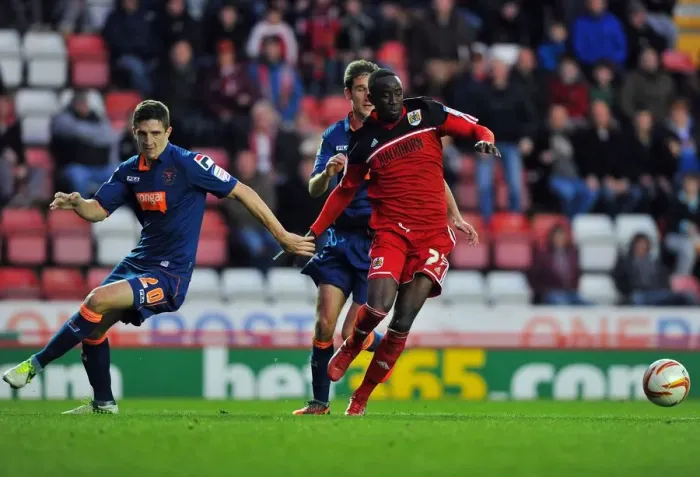 Framed Print : Bristol City vs Blackpool: Albert Adomah vs Craig Cathcart Battle for Ball in Championship Match