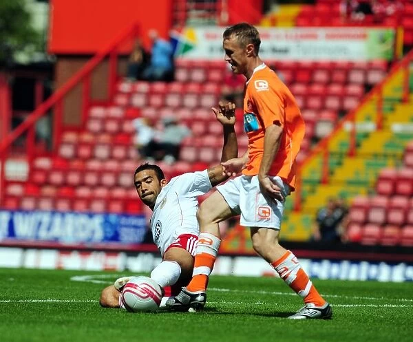 Bristol City vs Blackpool: Liam Fontaine's Intense Battle for Ball Possession - Championship Football Match, 2010