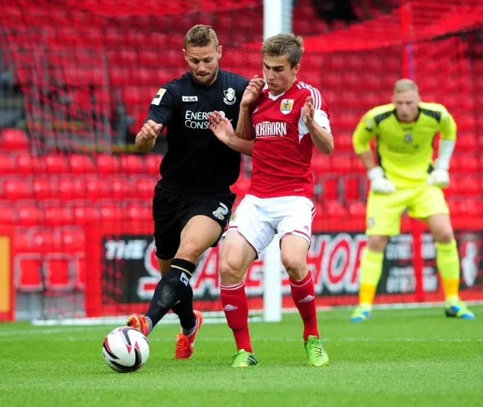 Framed Print : Bristol City vs Bournemouth: Joe Bryan vs Simon Francis - Intense Clash at Goldsands Stadium (Pre-Season Friendly)