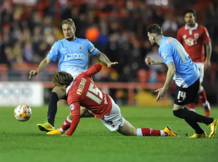 Framed Print : Bristol City vs Bradford City: Intense Moment as Luke Freeman Challenges Andrew Davies