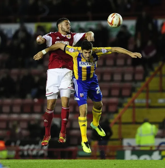 Framed Print : Bristol City vs Brentford: Derrick Williams Tackles Raphael Calvet