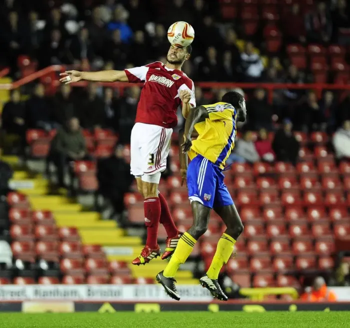 Framed Print : Bristol City vs Brentford: Intense Header Battle Between Derrick Williams and Clayton Donaldson Framed Print : Bristol City vs Brentford: Intense Header Battle Between Derrick Williams and Clayton Donaldson