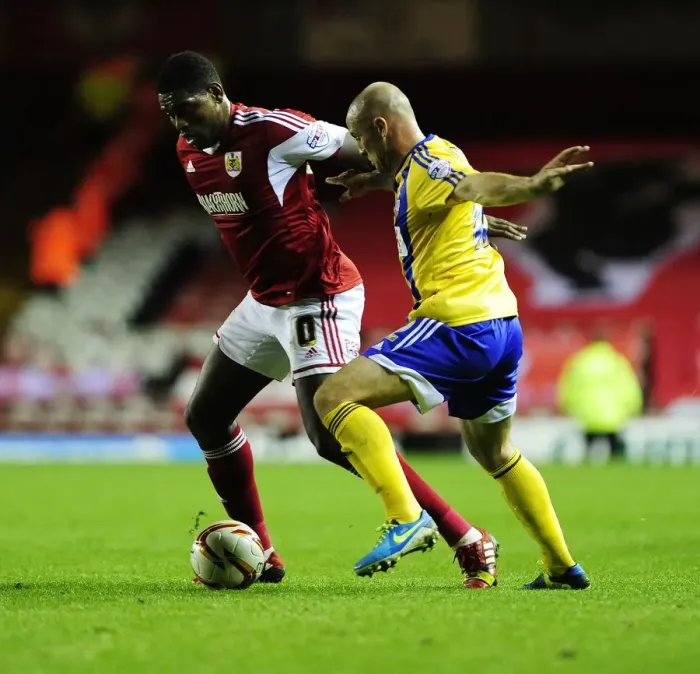 Framed Print : Bristol City vs Brentford: Jay Emmanuel-Thomas vs Alan McCormack - Intense Football Action