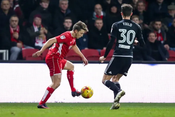 Framed Print : Bristol City vs Brentford: Luke Freeman vs Tom Field - Intense Championship Clash at Ashton Gate