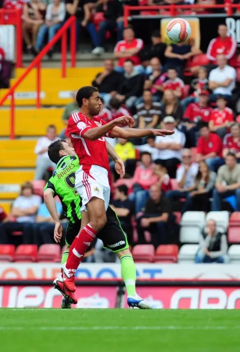 Framed Print : Bristol City vs Brighton: Lewin Nyatanga vs Ashley Barnes Battle for the Ball in Championship Match, September 10, 2011 - Editorial Use Only