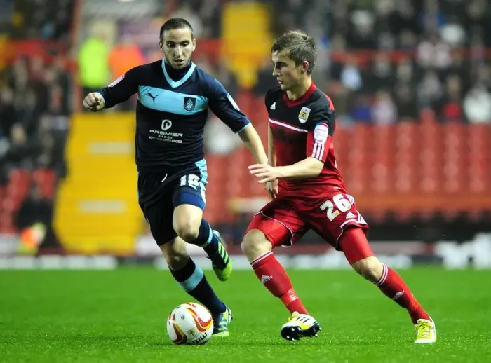 Framed Print : Bristol City vs Burnley: Joe Bryan Faces Martin Paterson Challenge in Championship Clash