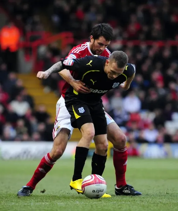 Framed Print : Bristol City vs. Cardiff City: Cole Skuse vs. Craig Bellamy - Intense Battle in the Championship (01 / 01 / 2011)