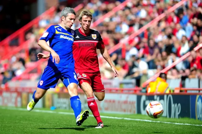 Framed Print : Bristol City vs. Cardiff City: Intense Moment between Woolford and McNaughton in Championship Clash