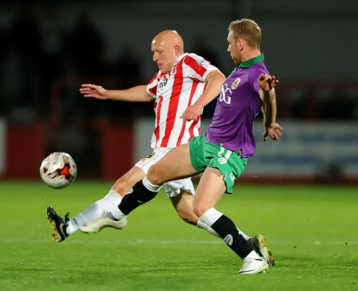 Framed Print : Bristol City vs Cheltenham Town: Intense Moment as Scott Wagstaff Faces Off Against Matt Richards