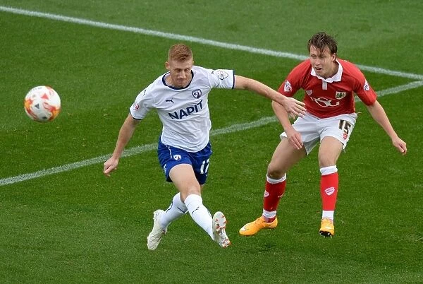 Bristol City vs Chesterfield: Luke Freeman Clears Under Pressure from Eoin Doyle