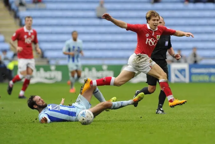 Framed Print : Bristol City vs Coventry City: Intense Moment as Luke Freeman is Tackled by James O'Brien Framed Print : Bristol City vs Coventry City: Intense Moment as Luke Freeman is Tackled by James O'Brien