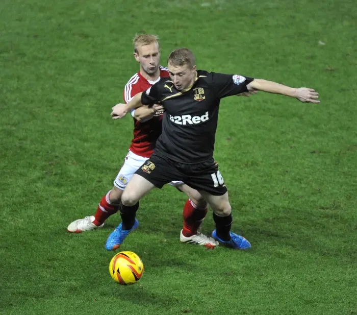 Framed Print : Bristol City vs Crawley Town: A Battle for Ball Possession