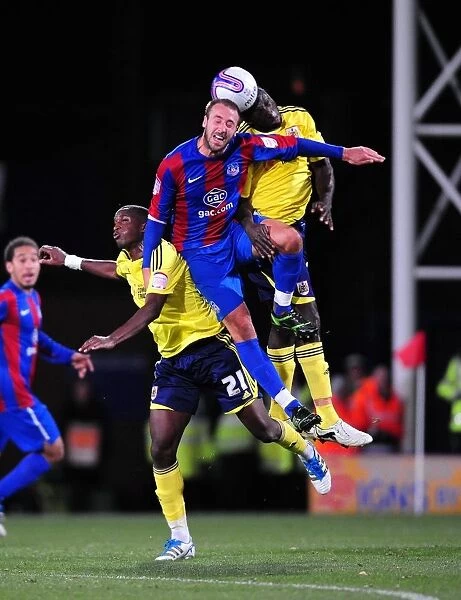 Bristol City vs Crystal Palace: Intense Aerial Battle Between Kalifa Cisse and Glenn Murray in Championship Match, 15th October 2011