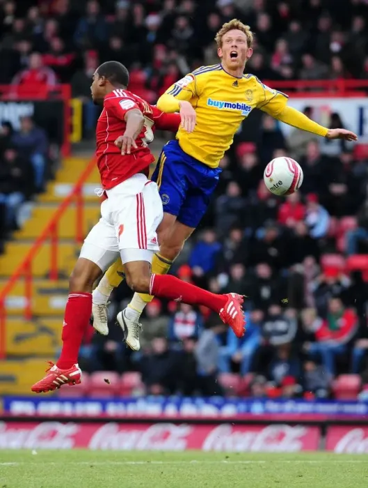 Framed Print : Bristol City vs Derby County: Marvin Elliott vs Paul Green - Championship Battle at Ashton Gate Stadium