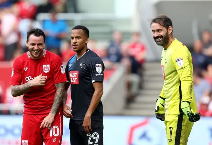 Framed Print : Bristol City vs. Derby County: A Light-Hearted Moment Between Scott Carson, Marcus Olsson, and Lee Tomlin