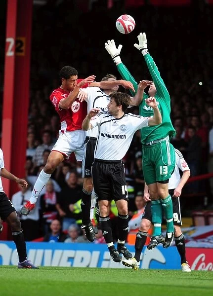 Bristol City vs Derby County: Nyatanga's Aerial Battle with Deeney and Barker, Championship Match, April 2010