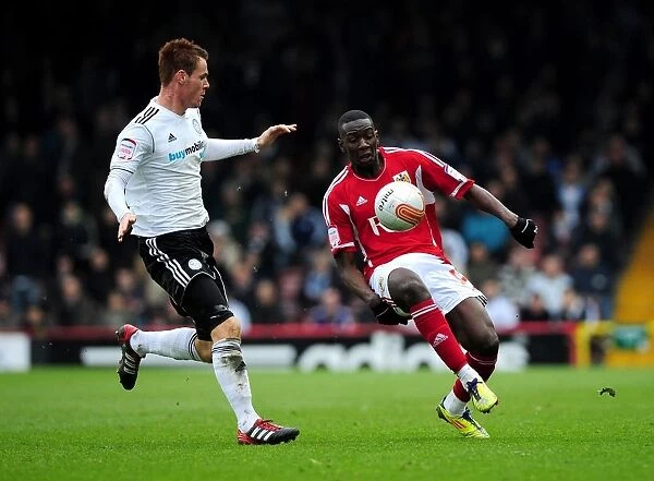 Bristol City vs Derby County: Yannick Bolasie and Tom Naylor Clash in Intense Football Match at Ashton Gate Stadium (March 2012)