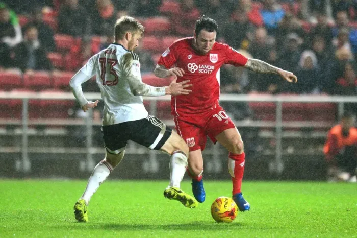 Framed Print : Bristol City vs Fulham: Intense Moment as Lee Tomlin Fights for the Ball against Tim Ream