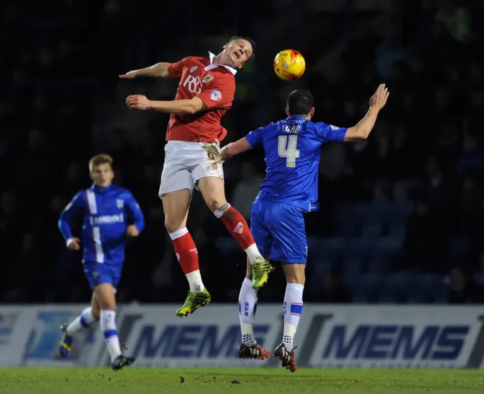 Framed Print : Bristol City vs Gillingham: Intense Header Battle - January 6, 2015 Framed Print : Bristol City vs Gillingham: Intense Header Battle - January 6, 2015