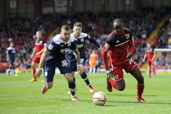 Framed Print : Bristol City vs. Huddersfield: Albert Adomah vs. Jack Hunt Battle in Championship Match Framed Print : Bristol City vs. Huddersfield: Albert Adomah vs. Jack Hunt Battle in Championship Match