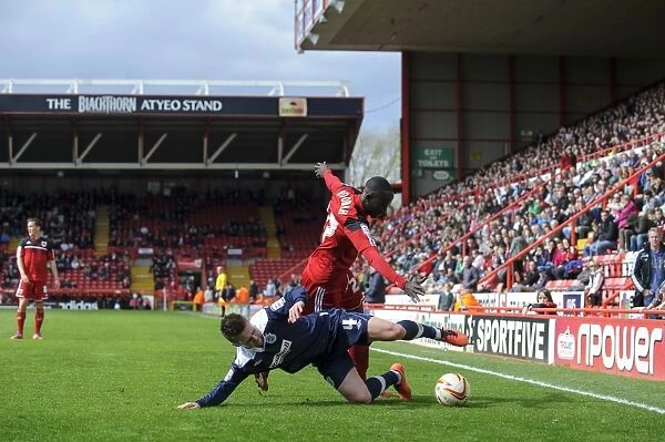 Bristol City vs. Huddersfield: Clash between Albert Adomah and Oliver Norwood in the npower Championship