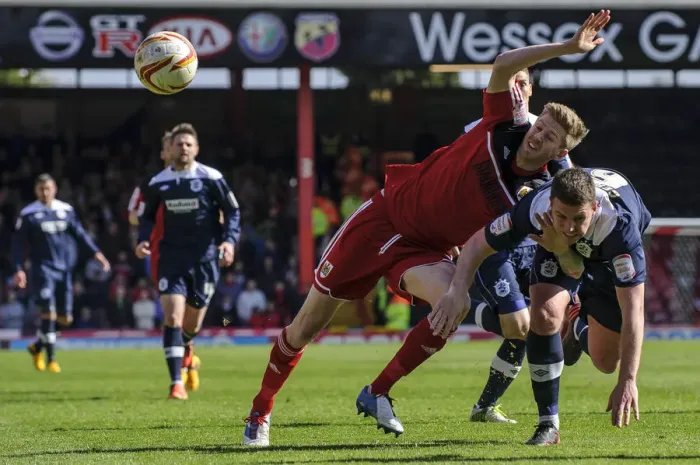 Framed Print : Bristol City vs. Huddersfield: Clash Between Stead and Gerrard in Championship Match