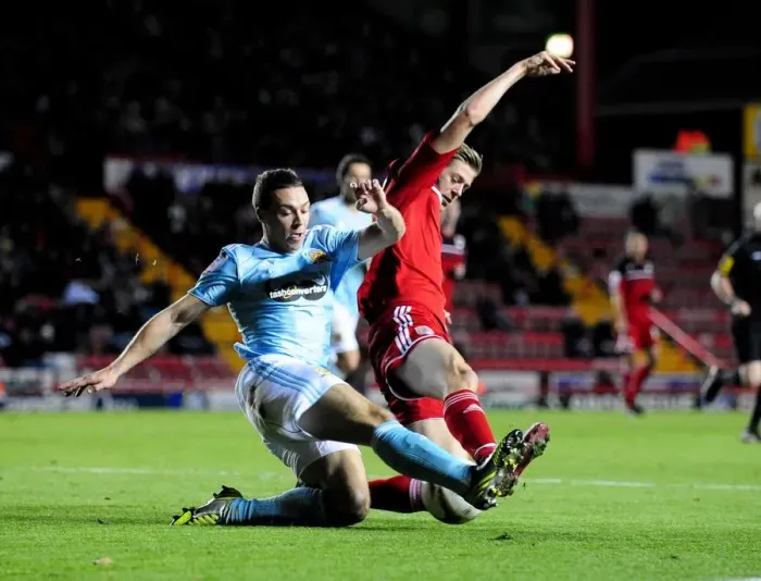 Framed Print : Bristol City vs Hull City: Jon Stead vs James Chester Battle in Championship Football Match