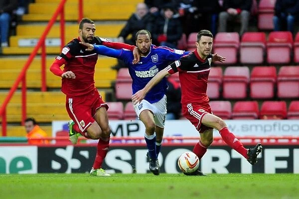 Bristol City vs Ipswich Town: Intense Moment as McGoldrick Tries to Break Through Fontaine and Skuse