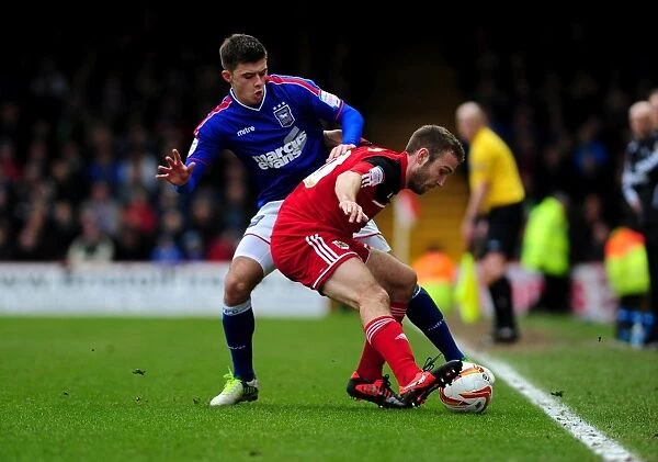 Bristol City vs Ipswich Town: Liam Kelly Secures Ball from Aaron Cresswell