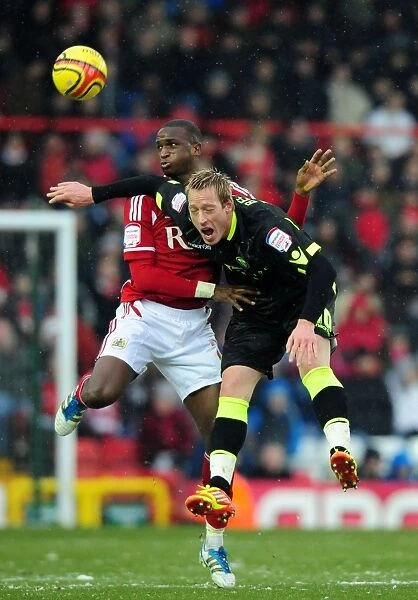 Bristol City vs Leeds United: Intense Aerial Battle Between Kalifa Cisse and Luciano Becchio in Championship Match