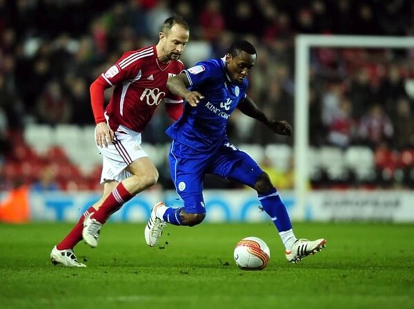Bristol City vs Leicester City: A Battle for the Ball between Louis Carey and Lloyd Dyer