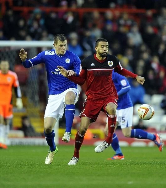 Bristol City vs Leicester City: Liam Fontaine vs Chris Wood Battle for Ball in Championship Match, January 2013