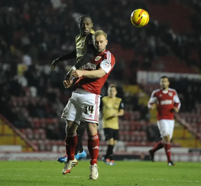 Framed Print : Bristol City vs Leyton Orient: Simon Gillett's Intense Challenge in Sky Bet League One Clash Framed Print : Bristol City vs Leyton Orient: Simon Gillett's Intense Challenge in Sky Bet League One Clash