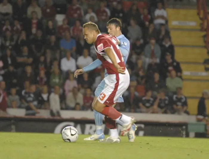 Framed Print : Bristol City vs Manchester City Rivalry: Lee Trundle's Clash of Football Titans