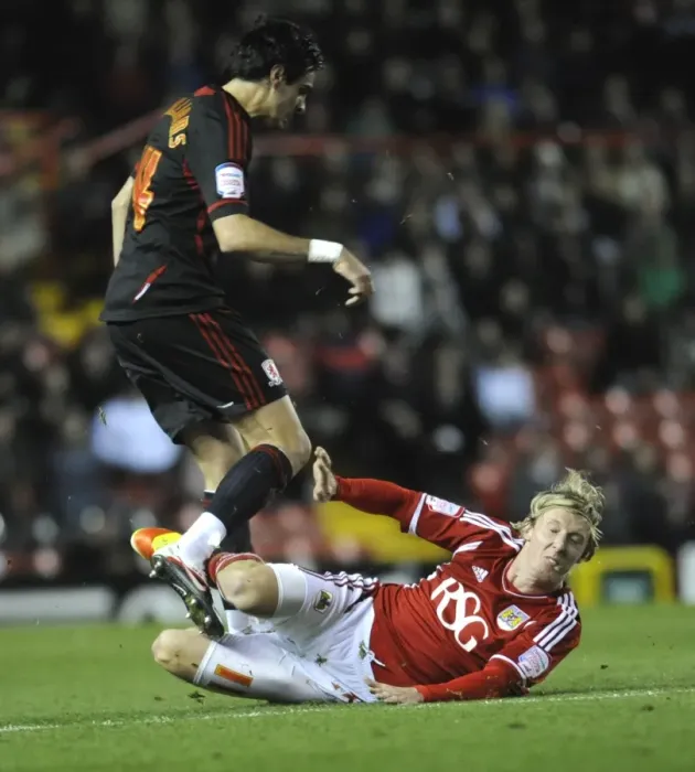 Framed Print : Bristol City vs Middlesbrough: Martyn Woolford Clashes with Rhys Williams