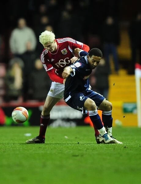 Bristol City vs Millwall: Ryan McGivern vs Liam Trotter Battle in Championship Match, January 2012 - Editorial Use Only