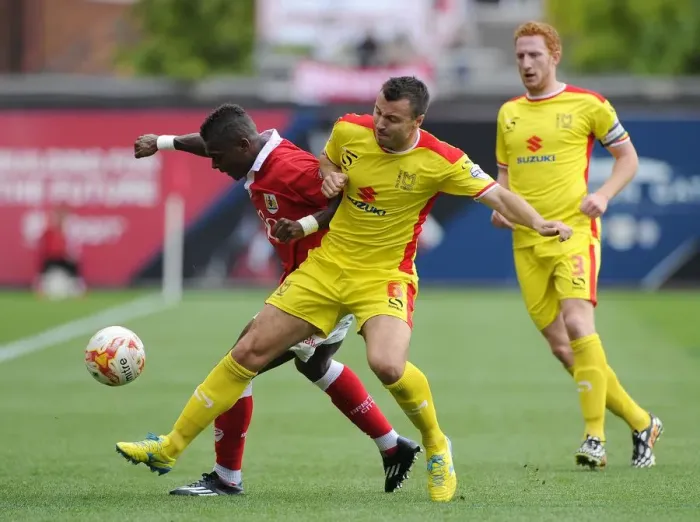 Framed Print : Bristol City vs MK Dons: Intense Battle Between Kieran Agard and Antony Kay Framed Print : Bristol City vs MK Dons: Intense Battle Between Kieran Agard and Antony Kay