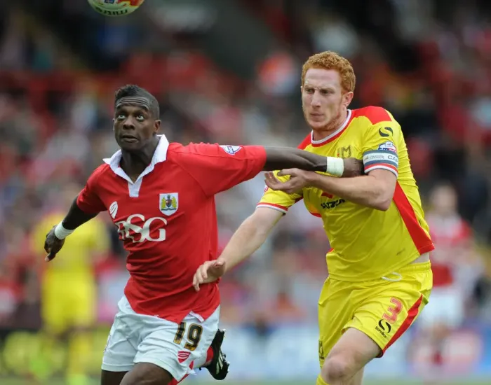 Framed Print : Bristol City vs MK Dons: Intense Battle for Possession between Kieran Agard and Dean Lewington