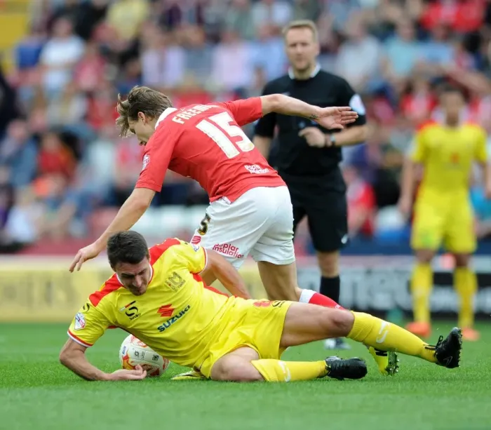 Framed Print : Bristol City vs MK Dons: Luke Freeman vs Darren Potter Clash in Sky Bet League One Framed Print : Bristol City vs MK Dons: Luke Freeman vs Darren Potter Clash in Sky Bet League One