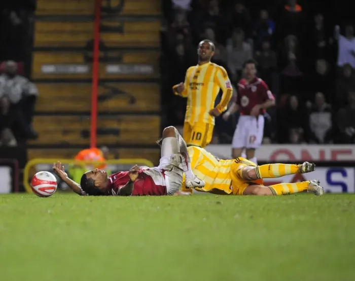 Framed Print : Bristol City vs Newcastle United: Marvin Elliott Fouls by Danny Guthrie - Championship Match (2010) Framed Print : Bristol City vs Newcastle United: Marvin Elliott Fouls by Danny Guthrie - Championship Match (2010)