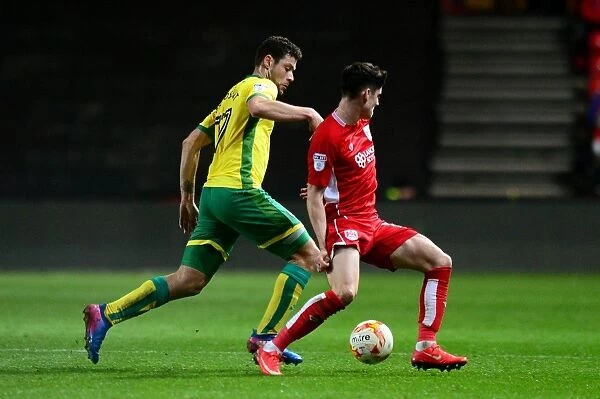 Bristol City vs Norwich City: Intense Battle for the Ball between Callum O'Dowda and Yanic Wildschut