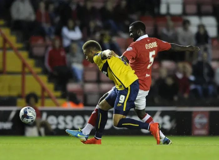 Framed Print : Bristol City vs Oxford United: Karleigh Osborne Tackles Carlton Morris in First Round Capital One Cup Clash Framed Print : Bristol City vs Oxford United: Karleigh Osborne Tackles Carlton Morris in First Round Capital One Cup Clash
