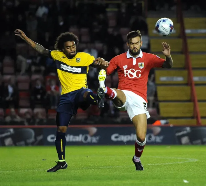 Framed Print : Bristol City vs Oxford United: Marlon Pack and Junior Brown Battle for Control