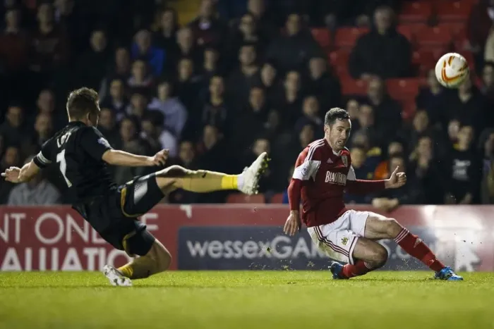Framed Print : Bristol City vs Port Vale: Intense Moment as Greg Cunningham Crosses Amidst Doug Loft's Challenge Framed Print : Bristol City vs Port Vale: Intense Moment as Greg Cunningham Crosses Amidst Doug Loft's Challenge
