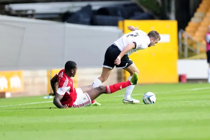 Framed Print : Bristol City vs Port Vale: Intense Moment between Jay Emmanuel-Thomas and Doug Loft