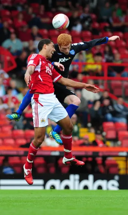 Framed Print : Bristol City vs Portsmouth: Intense Battle for the High Ball between Lewin Nyatanga and Dave Kitson in the 2008-09 Championship Match Framed Print : Bristol City vs Portsmouth: Intense Battle for the High Ball between Lewin Nyatanga and Dave Kitson in the 2008-09 Championship Match