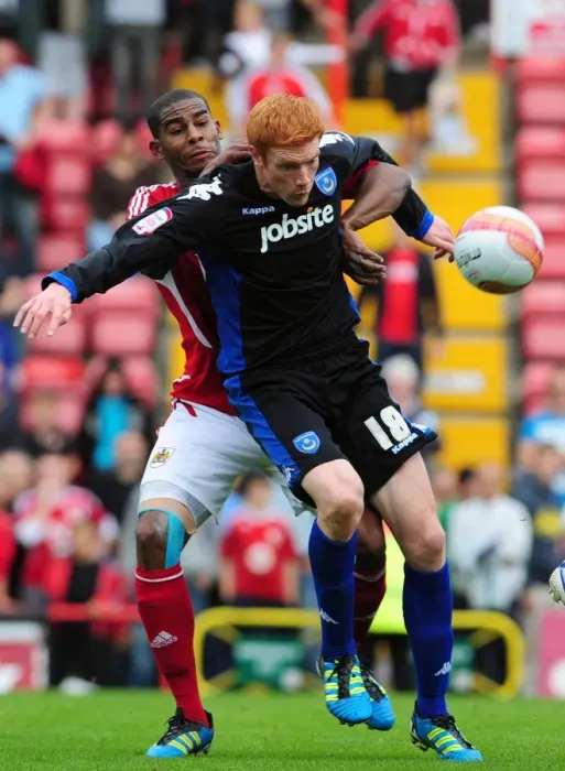 Framed Print : Bristol City vs. Portsmouth: Intense Battle Between Marvin Elliott and Dave Kitson in the 2008-09 Championship Match