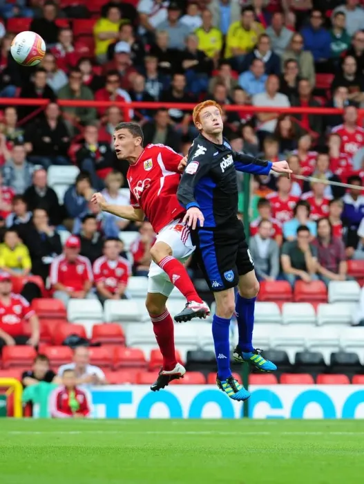 Framed Print : Bristol City vs Portsmouth: James Wilson vs Dave Kitson Battle for the High Ball - Championship Match, 2008-11