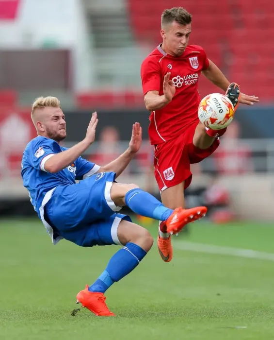 Framed Print : Bristol City vs Portsmouth: Joe Bryan Tackled by Jack Whatmough Framed Print : Bristol City vs Portsmouth: Joe Bryan Tackled by Jack Whatmough